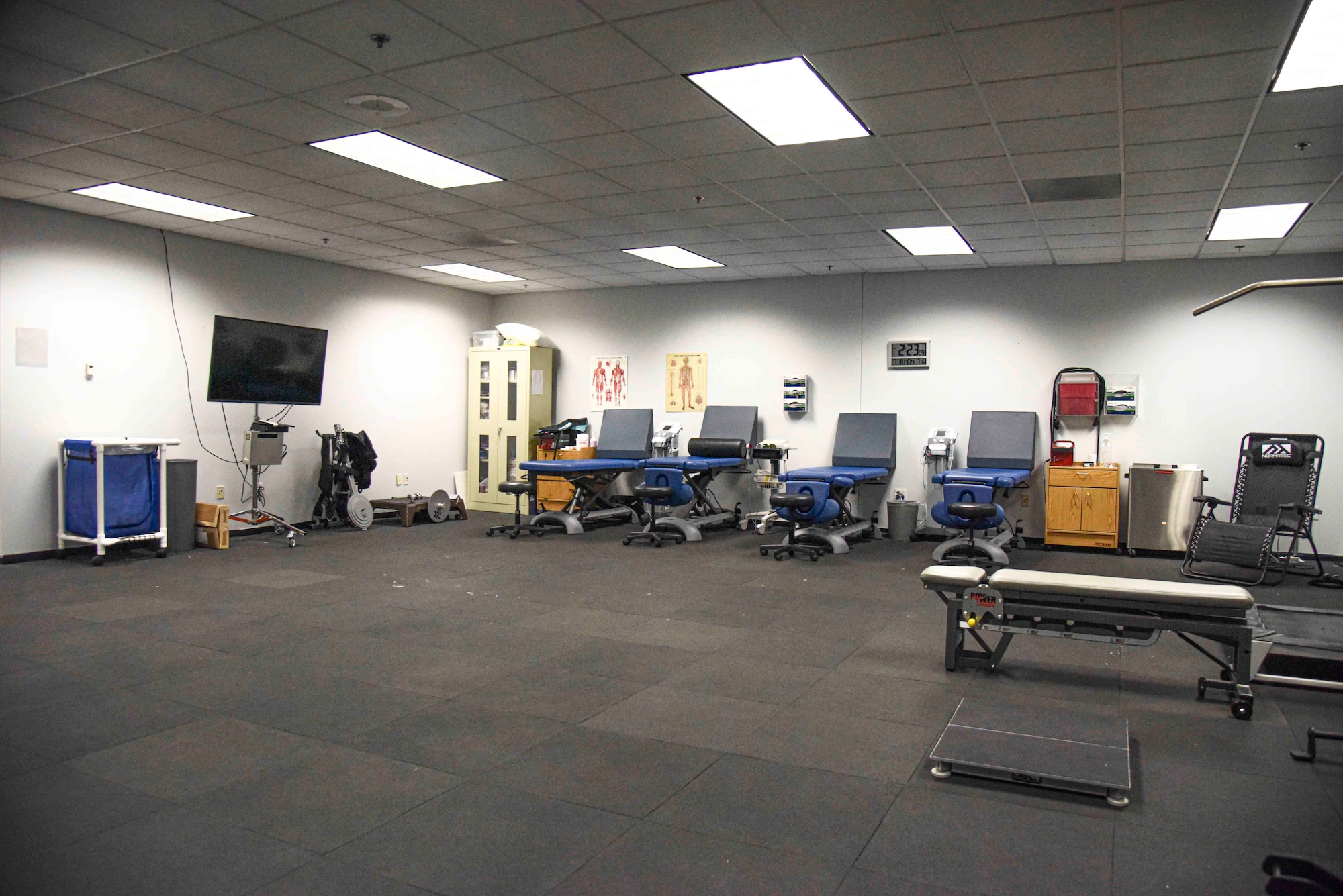 Pictured above is a room with various physical therapy tools and examination tables.