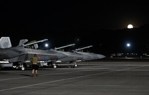 F-22 Raptors prepare to taxi on the flightline