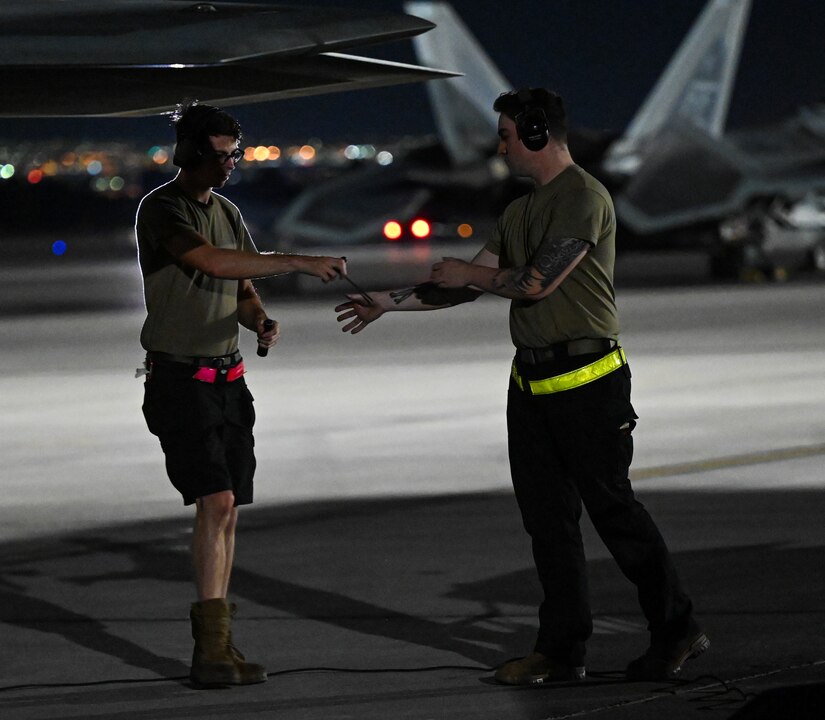 F-22 Raptors prepare to taxi on the flightline
