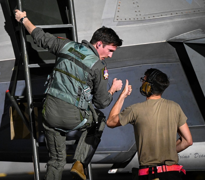 F-22 Raptors prepare to taxi on the flightline