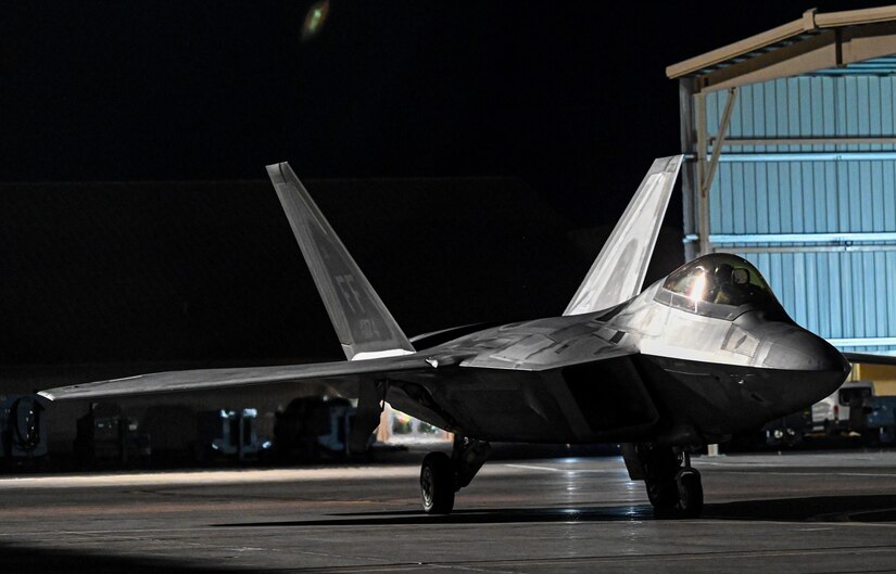 F-22 Raptors prepare to taxi on the flightline