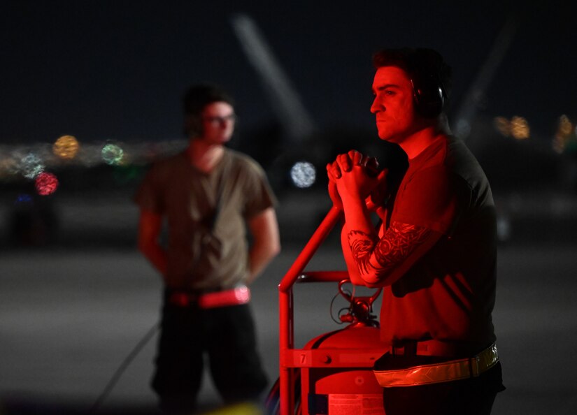 F-22 Raptors prepare to taxi on the flightline