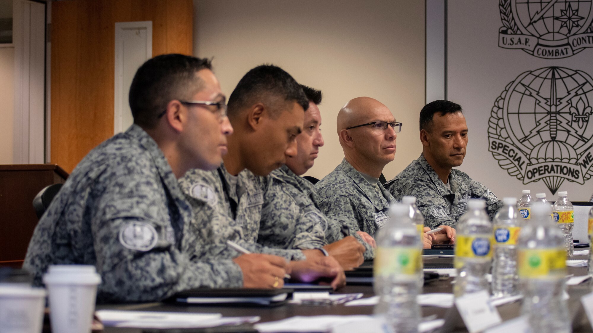 A delegation of Colombian Special Air Commands  leaders listen to a briefing on Air Force Special Warfare capabilities at Joint Base San Antonio-Chapman Training Annex, Texas, July. 25, 2022. The delegation visited the Special Warfare Training Wing for an immersion into the various Air Force Special Warfare career fields and pipelines.