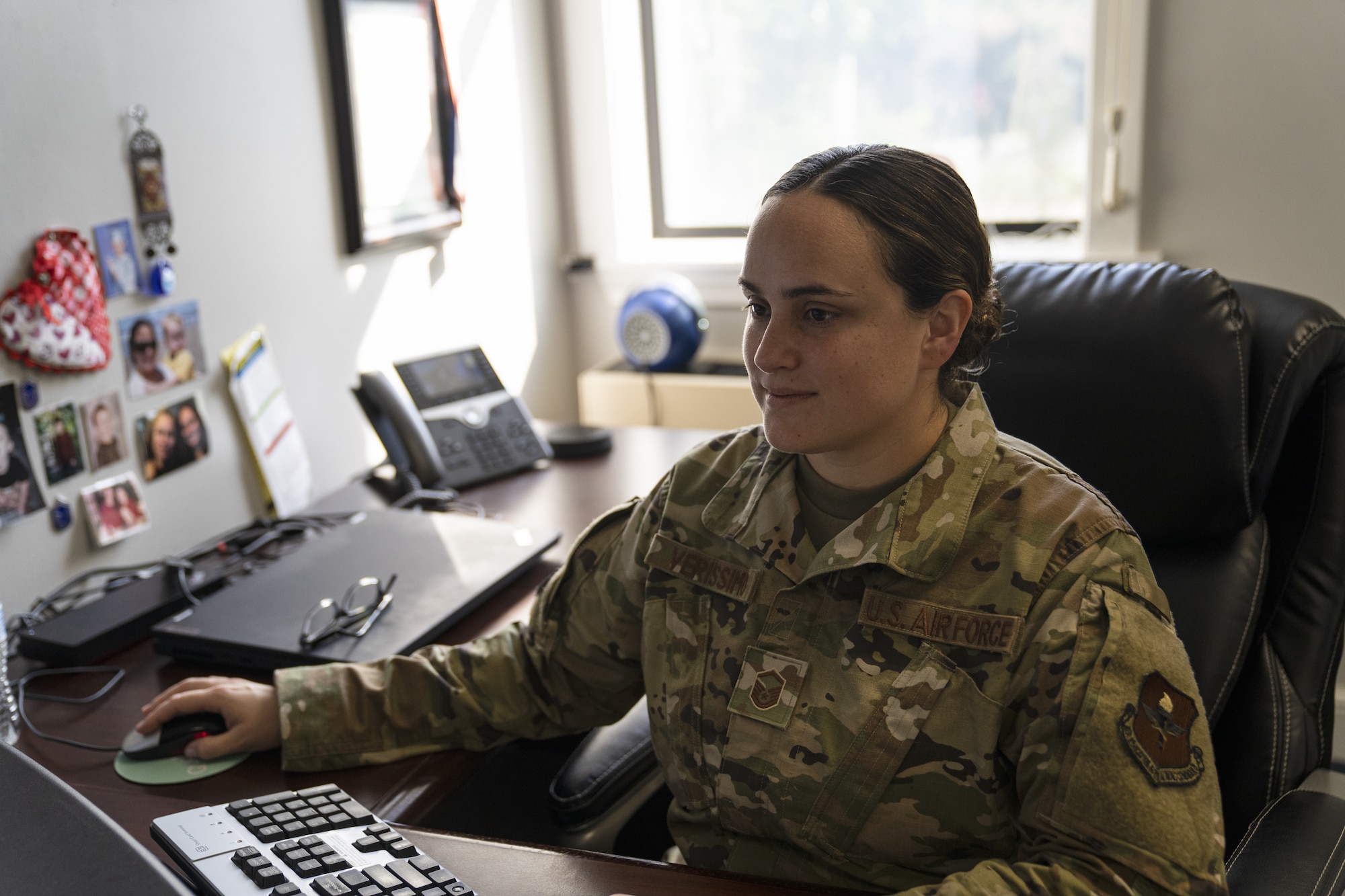 U.S. Air Force Master Sgt. Alexandria Verissimo, 81st Training Wing executive support services superintendent, uses a computer on Keesler Air Force Base, Mississippi, July 26, 2022. Education With Industry is a program that allows service members and civilians to be imbedded into companies to learn professional competencies. (U.S Air Force photo by Airman 1st Class Trenten Walters)