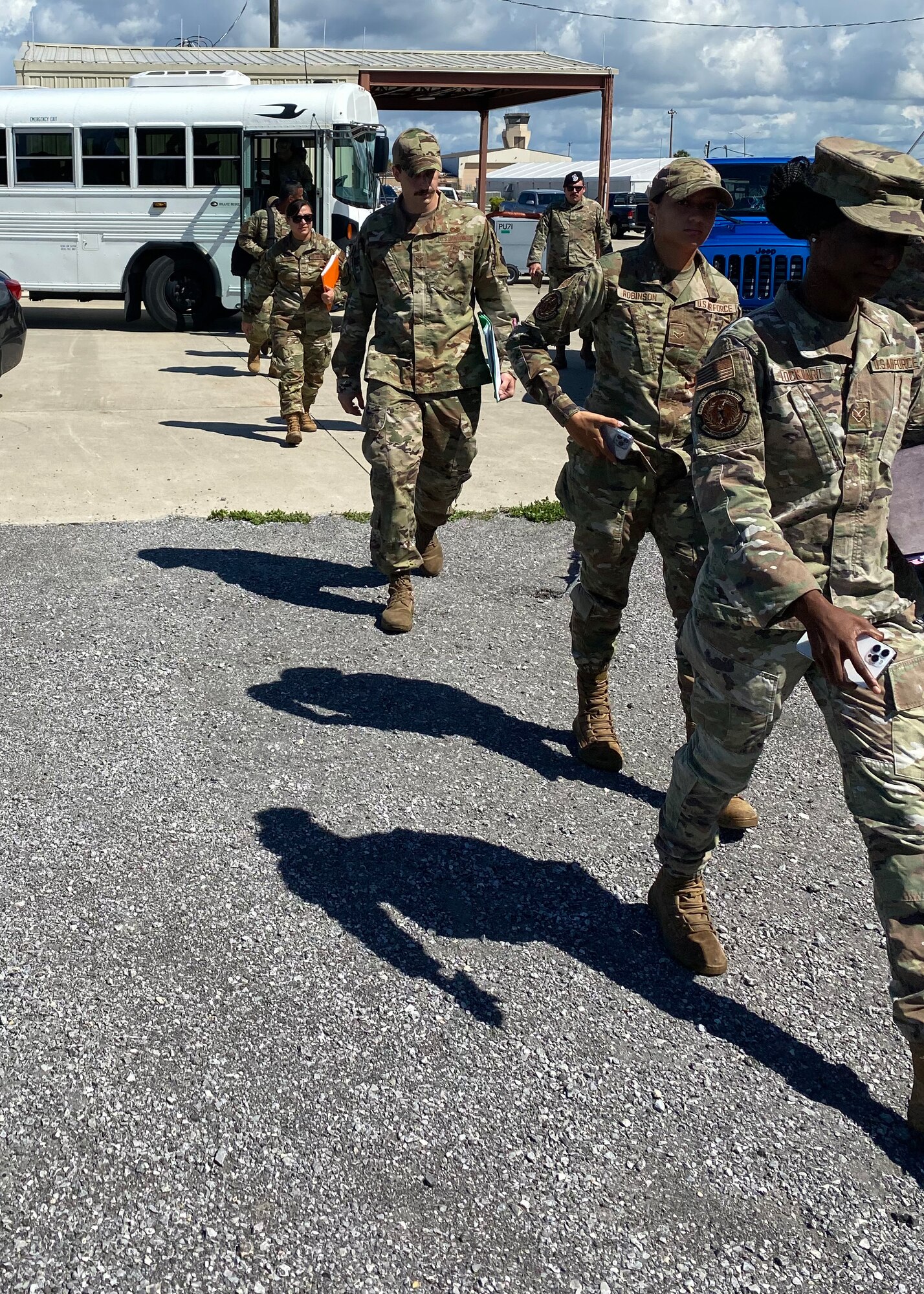 U.S. Airmen arrive at the 325th Logistics Readiness Squadron Installation Deployment Readiness Center staging area at Tyndall Air Force Base, Florida, July 6, 2022. Members must process through the IDRC to receive a predeployment briefing, have their Installation Personnel Readiness file checked and receive deployment orders. (Courtesy Photo)