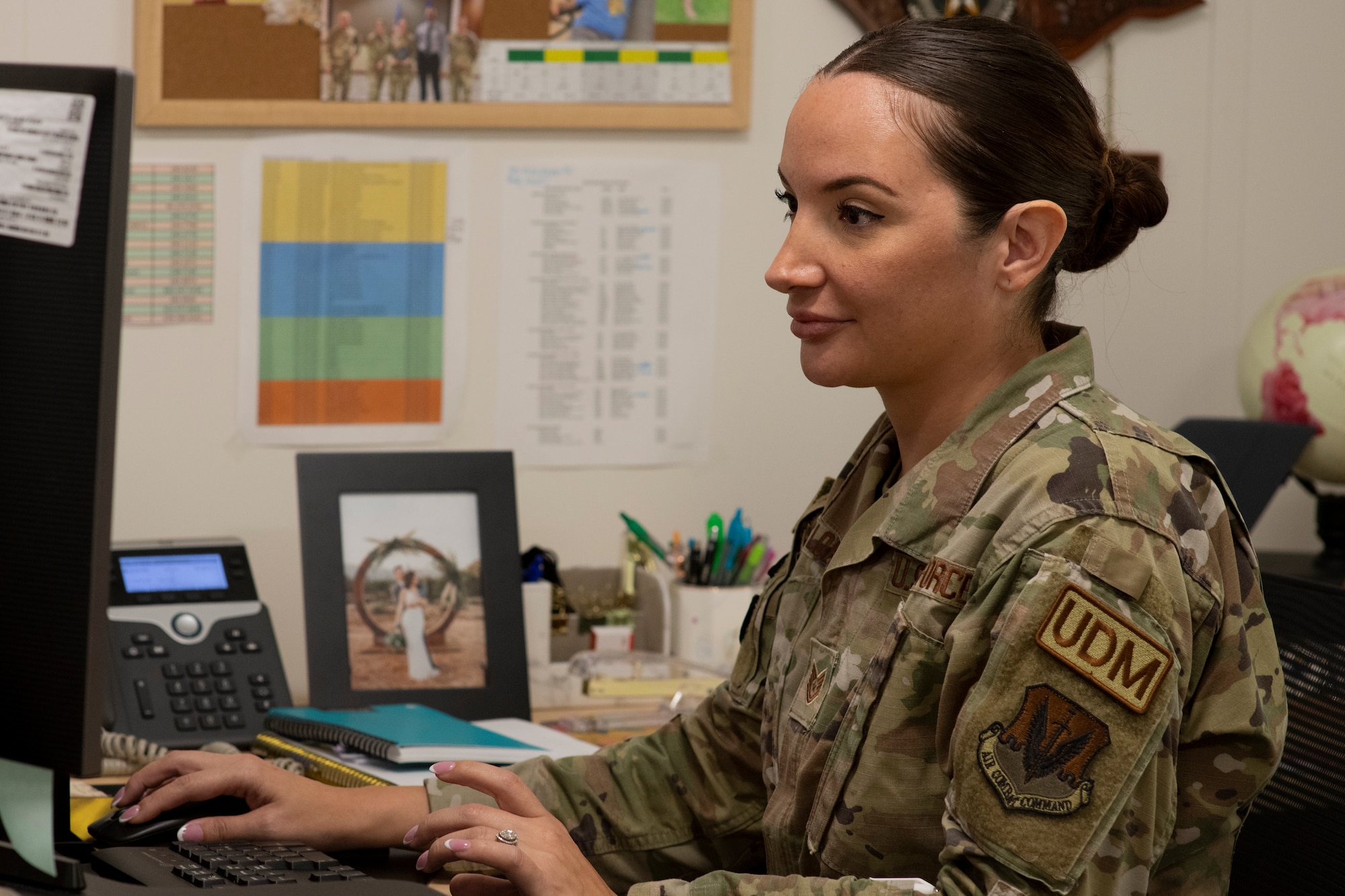 U.S. Air Force Tech. Sgt. Maria Cloherty, 325th Logistics Readiness Squadron unit deployment manager, reviews a unit deployment readiness tracker at Tyndall Air Force Base, Florida, July 15, 2022. In order to streamline upcoming deployments, UDMs must ensure their assigned unit is deployment ready on a daily basis. (U.S. Air Force photo by Staff Sgt. Cheyenne Lewis)