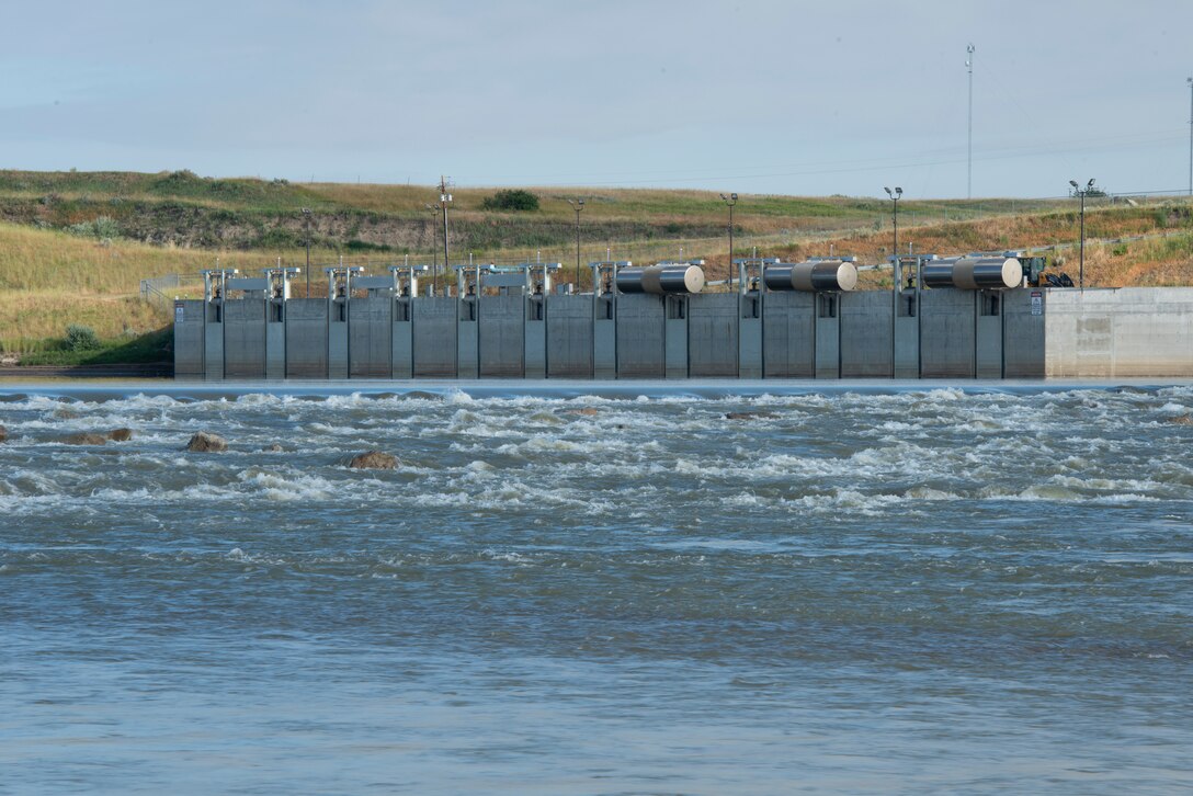 Water flows past the Lower Yellowstone intake canal headworks structure on the Yellowstone River near Glendive, Mont., approximately 70 miles upstream from the mouth of the river, July 26, 2022. (U.S. Army Corps of Engineers Photo by Jason Colbert)