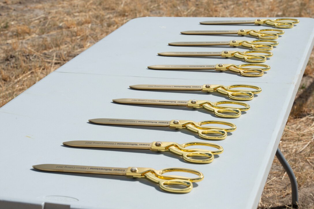 Golden scissors sit ready for a ceremony at the Lower Yellowstone Bypass ribbon cutting ceremony in Glendive, Mont., July 26, 2022. (U.S. Army Corps of Engineers Photo by Jason Colbert)