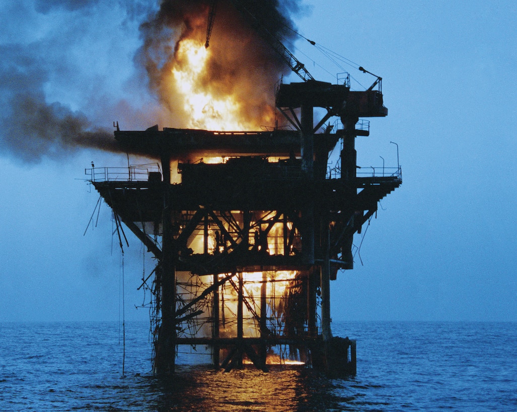 Iranian oil platform Rashadat is set afire after being shelled
by four U.S. Navy destroyers during Operation Nimble Archer, October 19, 1987 (U.S. Navy/Henry Cleveland)