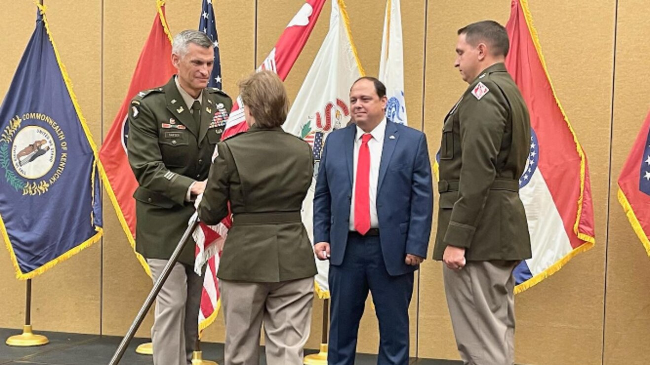 Col. Brian D. Sawser (far left) receives the Memphis District colors from Mississippi Valley Division Commander Maj. Gen. Diana M. Holland (center-left), which symbolizes the assumption of command from Lt. Col. Robert W. Green (far right), Memphis District deputy commander. Memphis District Deputy District Engineer for Programs and Project Management Donny D. Davidson (center-right) participates in the assumption of command.