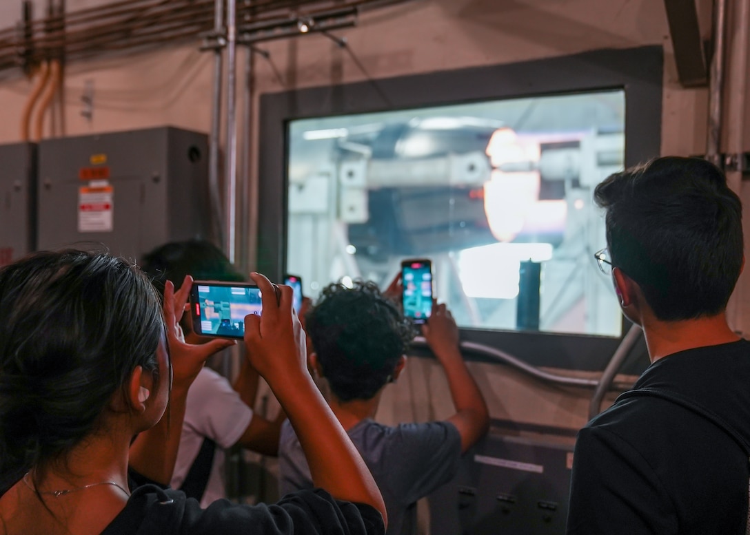 PRIME students watch a jet engine test during a visit to the 412th Maintenance Squadron Propulsion Flight on Edwards Air Force Base, California, June 27. The tour helped kids understand the correlation between math and STEM careers on base. (Air Force photo by Carol Otero)