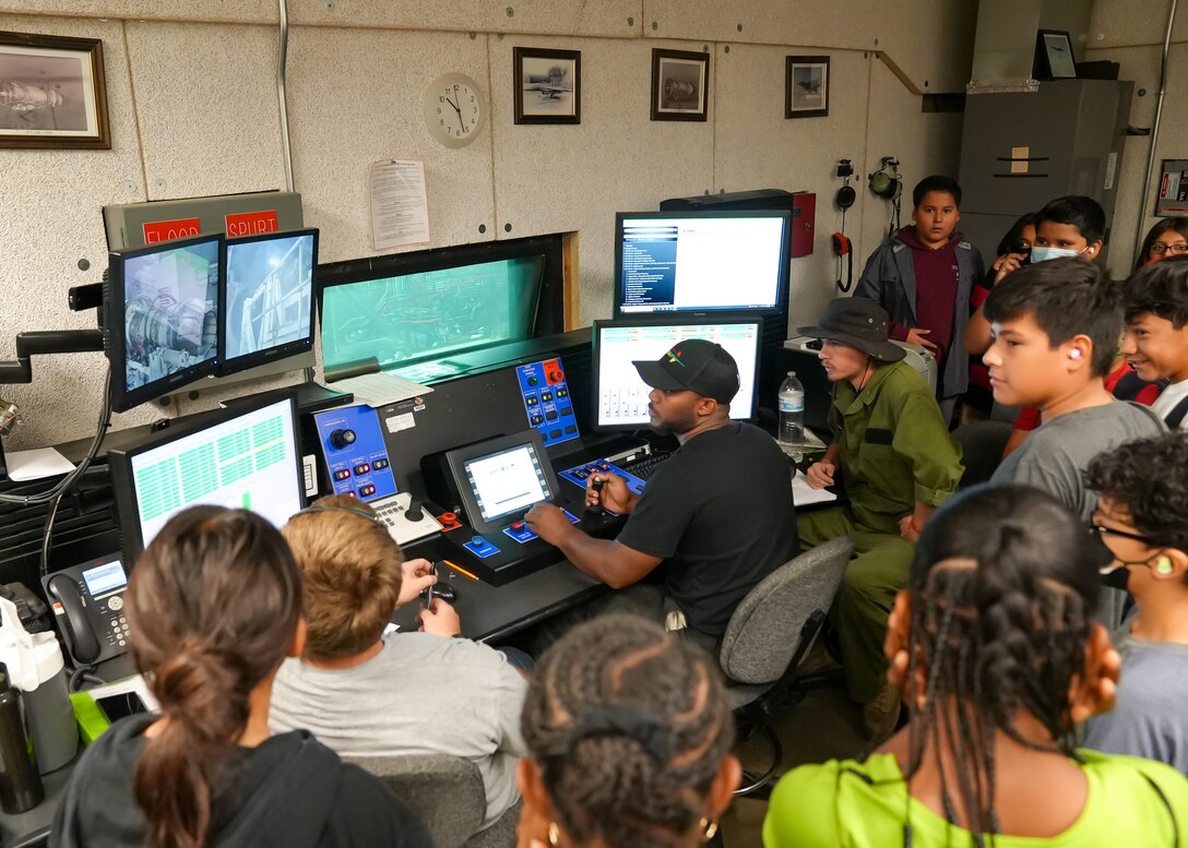 PRIME students watch a jet engine test during a visit to the 412th Maintenance Squadron Propulsion Flight on Edwards Air Force Base, California, June 27. Promoting Relevance and Interest in Mathematics Experiences, or PRIME, is a pilot program designed to prepare students for high school algebra. (Air Force photo by Carol Otero)