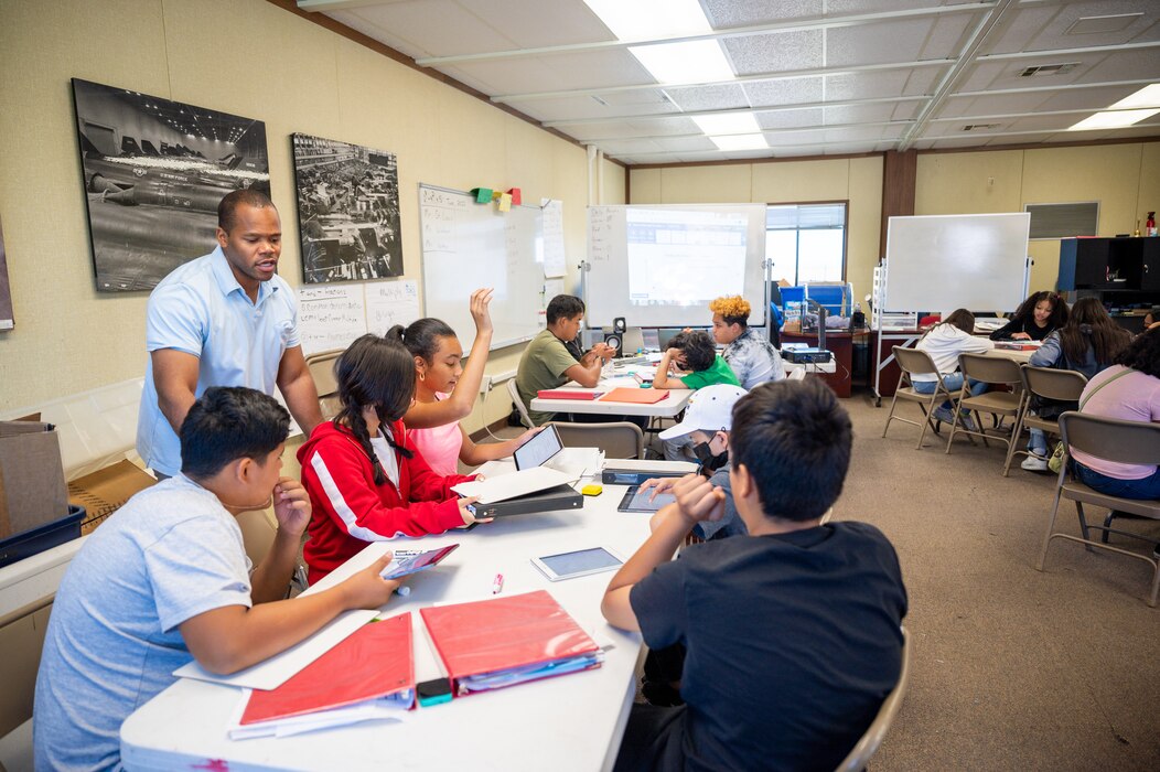Volunteer teacher Woodley St. Louis instructs a group students during a Promoting Relevance and Interest in Mathematics Experiences, or PRIME, class session at Blackbird Airpark in Palmdale, California, June 29. The pilot program is designed to prepare students for high school algebra. (Air Force photo by Giancarlo Casem)