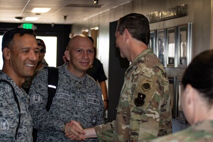 U.S. Air Force Col. Nathan Colunga (right), Special Warfare Training Wing commander, greets Columbian Air Force Brig. Gen. Frederico Bocanegra Bernal, chief of security and defense of base, at Joint Base San Antonio-Chapman Training Annex, Texas, July 25, 2022. Bocanegra and a delegation of Colombian Special Air Commands leaders visited the SWTW for an immersion into on the various Air Force Special Warfare career fields and pipelines.