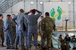 A delegation of Colombian Special Air Commands leaders observe Special Warfare Training Wing trainees conduct water confidence training at Joint Base San Antonio-Lackland, Texas, July. 25, 2022. The delegation visited the Special Warfare Training Wing for an immersion into the various Air Force Special Warfare career fields and pipelines.