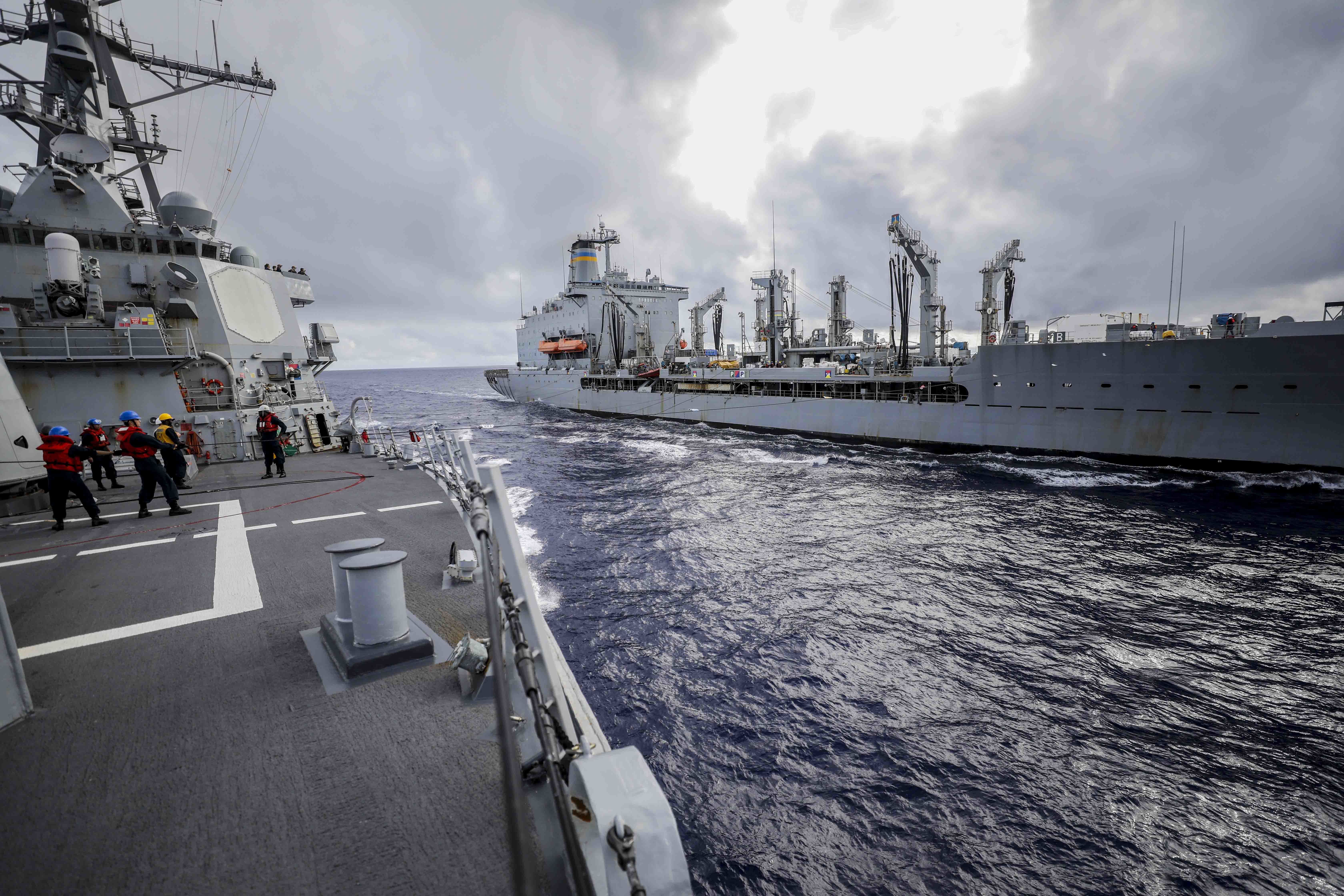 The Arleigh Burke-class guided-missile destroyer USS Higgins (DDG 76), left, approaches Henry J. Kaiser-class underway replenishment oiler USNS Yukon (T-AO 202) for a replenishment-at-sea.