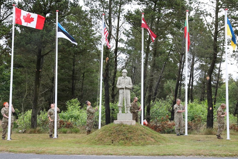 Participants for MREP 2022 work together on team building exercises at Camp Nymindegab July 7, 2022. MREP is a program that houses almost 130 participants from 6 different nations, to increase interoperability, strengthen partnerships, and to enhance professional development between allies.