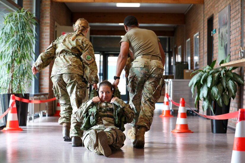 Participants for MREP 2022 work together on team building exercises at Camp Nymindegab July 5, 2022. MREP is a program that houses almost 130 participants from 6 different nations, to increase interoperability, strengthen partnerships, and to enhance professional development between allies.