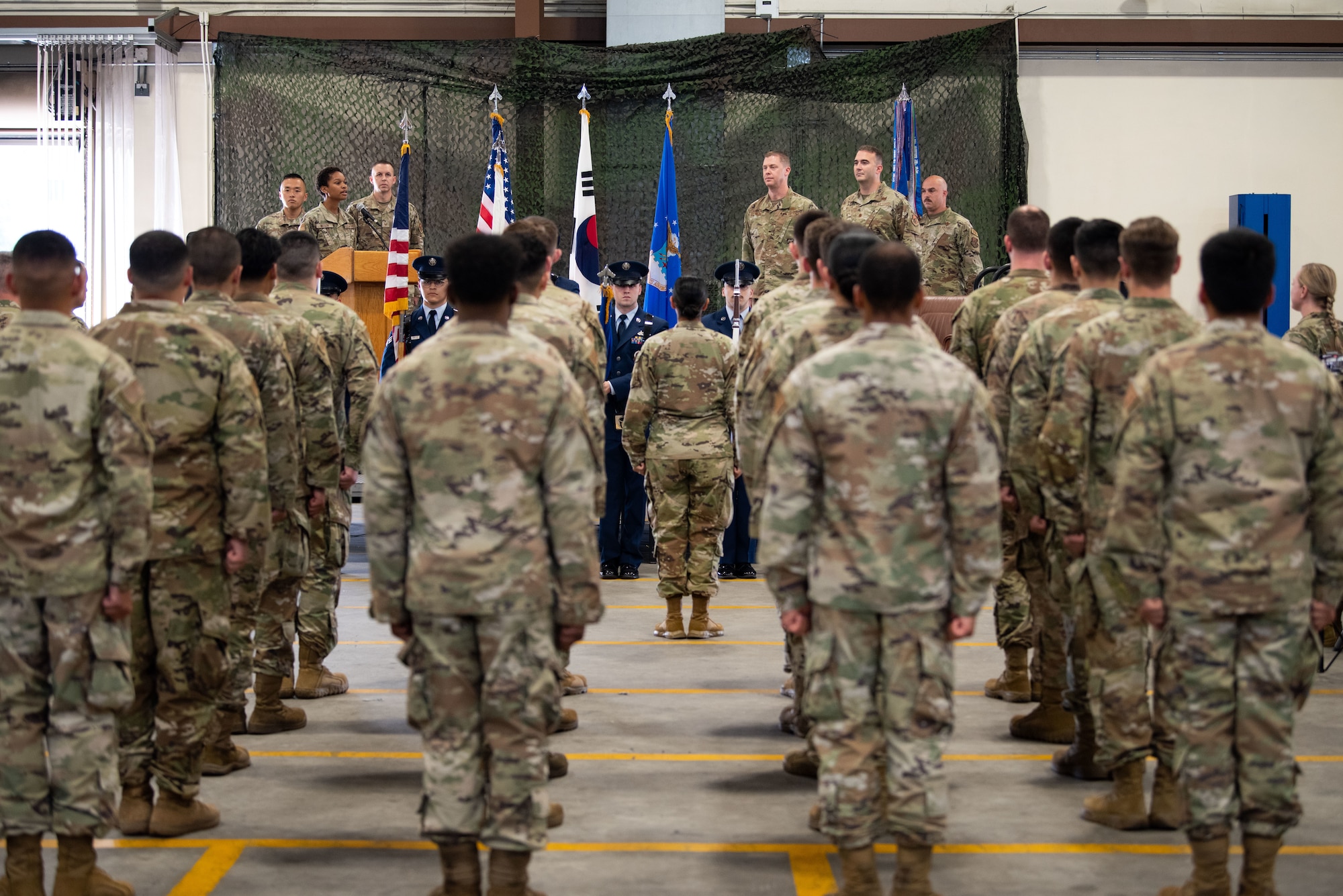 Airmen assigned to the 51st Logistics Readiness Squadron, stand at attention for the playing of the National Anthem during the squadron’s assumption of command at Osan Air Base, Republic of Korea, July 22, 2022.