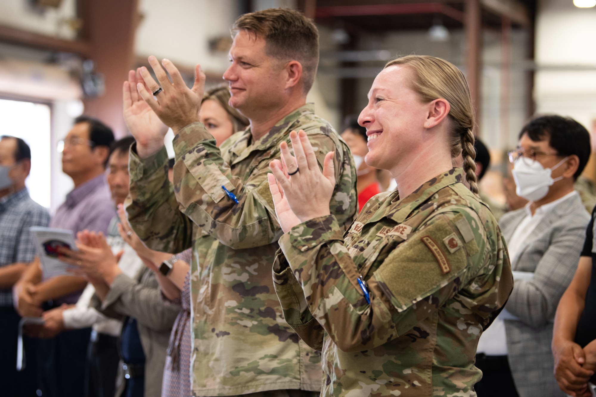 Members of the audience applaud Maj. Vincent McLean, 51st Logistics Readiness Squadron’s newly appointed commander, during the squadron’s assumption of command ceremony at Osan Air Base, Republic of Korea, July 22, 2022.