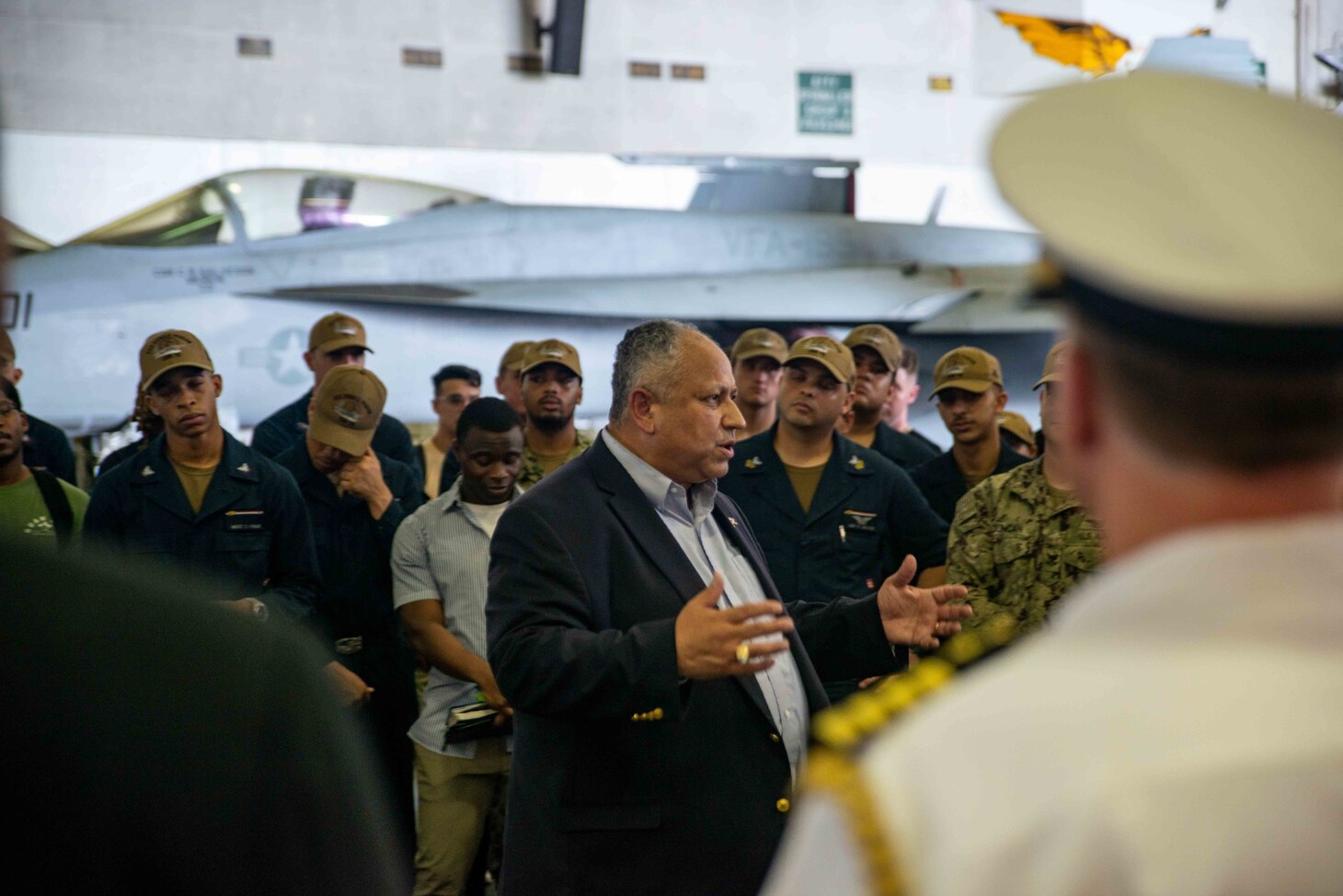 CHANGI NAVAL BASE, Singapore (July 22, 2022) – Secretary of the Navy Carlos Del Toro meets with Sailors in the hangar bay of the U.S. Navy’s only forward-deployed aircraft carrier USS Ronald Reagan (CVN 76). During Del Toro’s visit, he held a press conference and addressed the crew over the ships 1MC. Ronald Reagan, the flagship of Carrier Strike Group 5, provides a combat-ready force that protects and defends the United States, and supports alliances, partnerships and collective maritime interests in the Indo-Pacific region. (U.S. Navy photo by Mass Communication Specialist 3rd Class Gray Gibson)