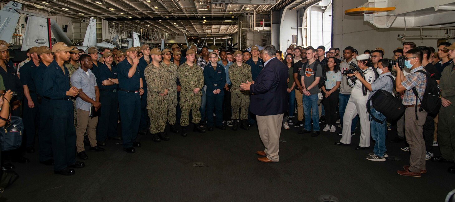 CHANGI NAVAL BASE, Singapore (July 22, 2022) – Secretary of the Navy Carlos Del Toro meets with Sailors in the hangar bay of the U.S. Navy’s only forward-deployed aircraft carrier USS Ronald Reagan (CVN 76). During Del Toro’s visit, he held a press conference and addressed the crew over the ships 1MC. Ronald Reagan, the flagship of Carrier Strike Group 5, provides a combat-ready force that protects and defends the United States, and supports alliances, partnerships and collective maritime interests in the Indo-Pacific region. (U.S. Navy Photo by Mass Communication Specialist 3rd Class Gray Gibson)