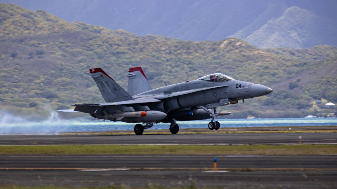 MARINE CORPS BASE HAWAII, Hawaii (July 22, 2022) An F/A-18, Hornet assigned to Marine Fighter Attack Squadron 232, Marine Air-Ground Task Force 7, fired upon the decommissioned ex-USS Denver (LPD9) July 22, during a sinking exercise (SINKEX) to gain proficiency in tactics, targeting, and live-firing against a surface target at sea. SINKEX vessels are put through a certified cleaning process, including removing all environmentally harmful material including trash, floatable material, mercury, fluorocarbon and petroleum. Twenty-six nations, 38 ships, three submarines, more than 170 aircraft and 25,000 personnel are participating in RIMPAC from June 29 to Aug. 4 in and around the Hawaiian Islands and Southern California. The world's largest international maritime exercise, RIMPAC provides a unique training opportunity while fostering and sustaining cooperative relationships among participants critical to ensuring the safety of sea lanes and security on the world's oceans. RIMPAC 2022 is the 28th exercise in the series that began in 1971. (U.S. Marine Corps photo by Lance Cpl. Haley Fourmet Gustavsen)