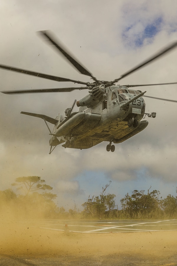 A U.S. Marine Corps CH-53E Super Stallion with Marine CH-53E Super Stallion with Marine Heavy Helicopter Squadron 361, currently assigned to 1st Marine Aircraft wing, lands in order to conduct helicopter support team operations at Jungle Warfare Training Center, Okinawa, Japan, July 19, 2022. 3rd MLG, based out of Okinawa, Japan, is a forward-deployed combat unit that serves as III Marine Expeditionary Force’s comprehensive logistics and combat service support backbone for operations throughout the Indo-Pacific area of responsibility. (U.S. Marine Corps photo by Lance Cpl. Sebastian A Riveraaponte)