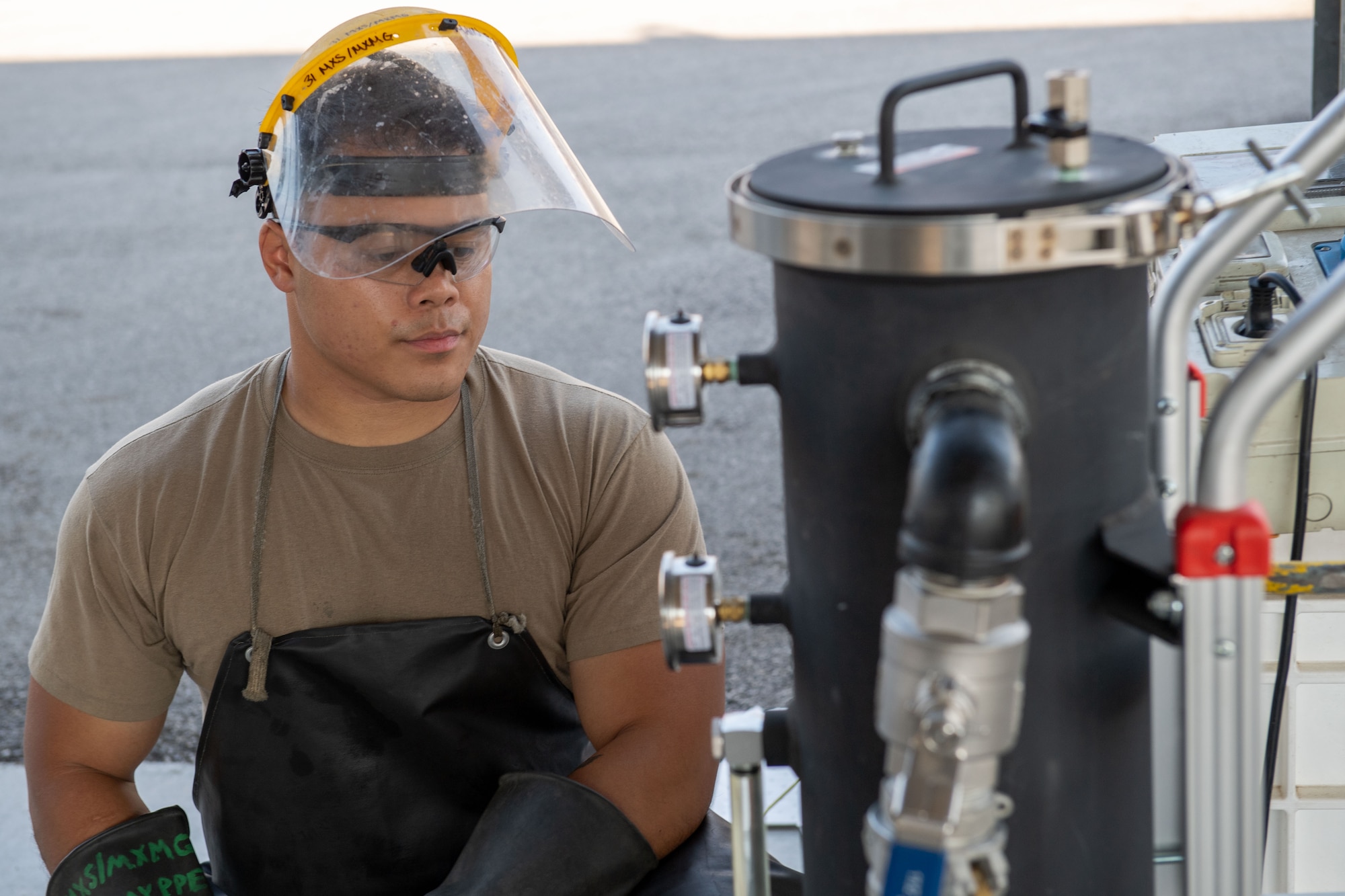 U.S. Air Force Senior Airman Shane Villegas, 31st Maintenance Squadron aerospace ground equipment (AGE) journeyman, inspects the AGE fuel polisher