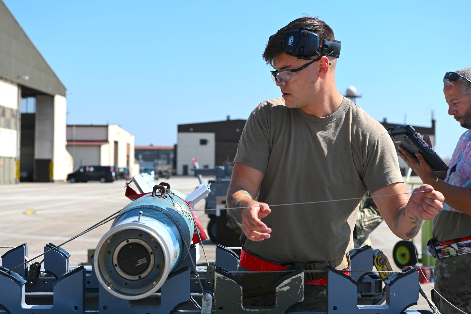 Airman preparing missile for loading