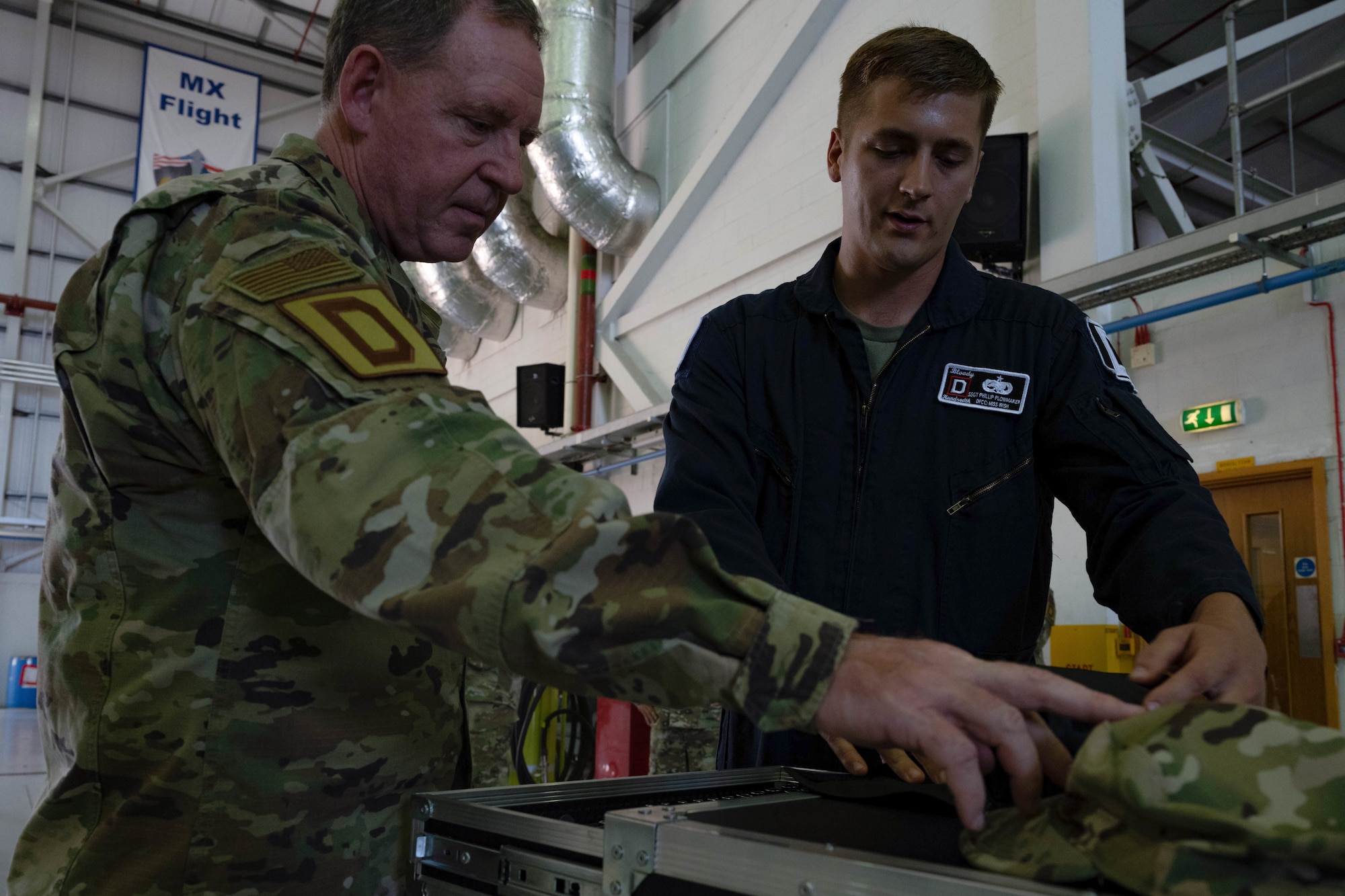 Mrs. Abby Johnson (right) briefs Mrs. Terrie Hecker (left) on the Airmen and Family Readiness Center’s resources, Royal Air Force Mildenhall, England, July 18, 2022. U.S. Air Force Gen. James Hecker, U.S. Air Forces in Europe - Air Forces Africa commander, and his spouse, Mrs. Hecker visited RAF Mildenhall during their initial command tour allowing them to get a first hand perspective of how the base is currently operating. (U.S. Air Force photo by Airman 1st Class Viviam Chiu)