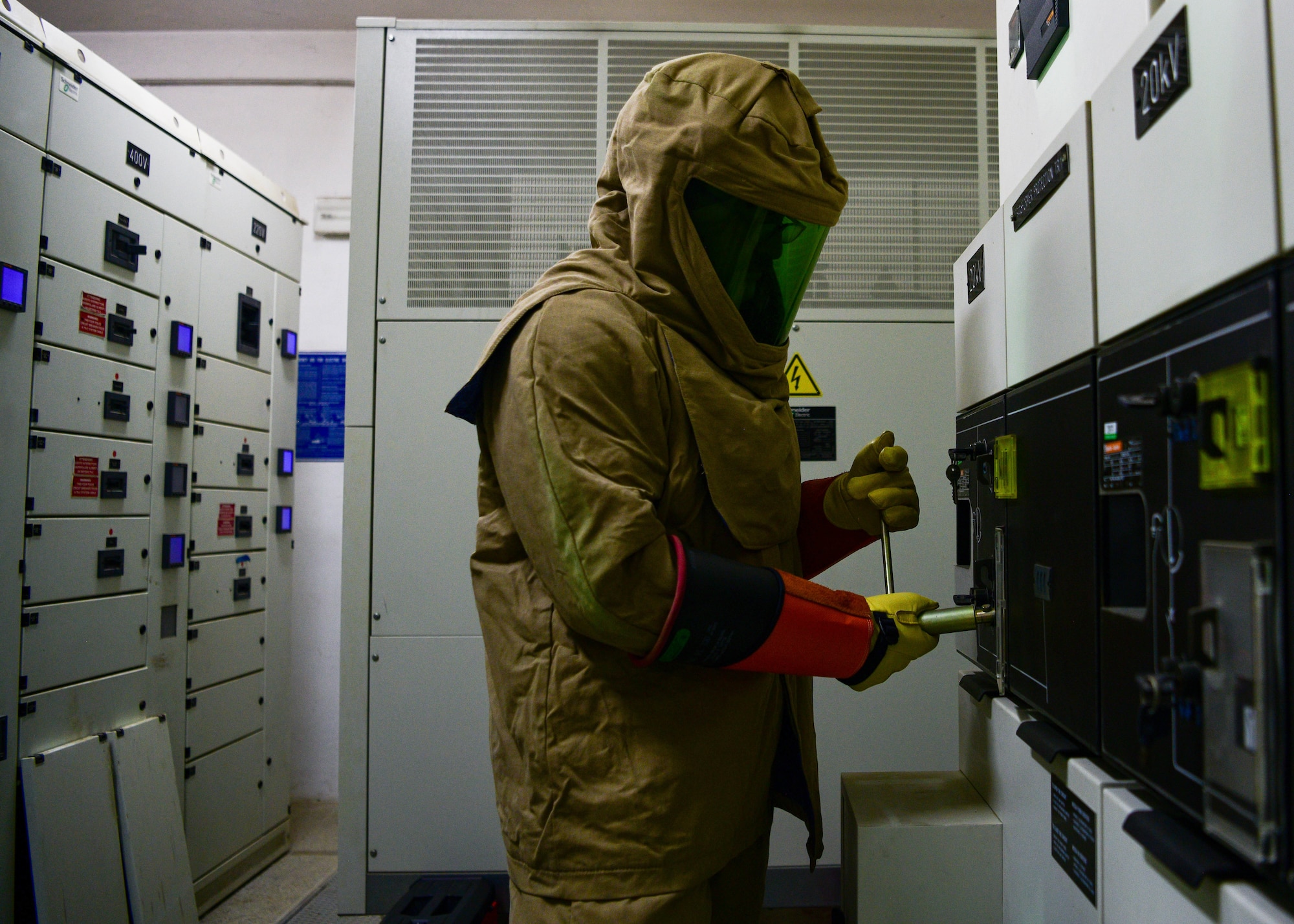 U.S. Air Force Airman 1st Class Nicolas Artura, 31st Civil Engineer Squadron electrical systems apprentice, turns the power off to a medium voltage circuit breaker during scheduled maintenance at Aviano Air Base, Italy, June 21, 2022. The Air Force Civil Engineer Center’s Civil Engineer Maintenance, Inspection and Repair Team was at Aviano AB for approximately a month to assist the 31st CES and perform scheduled maintenance on substations. (U.S. Air Force photo by Senior Airman Brooke Moeder)