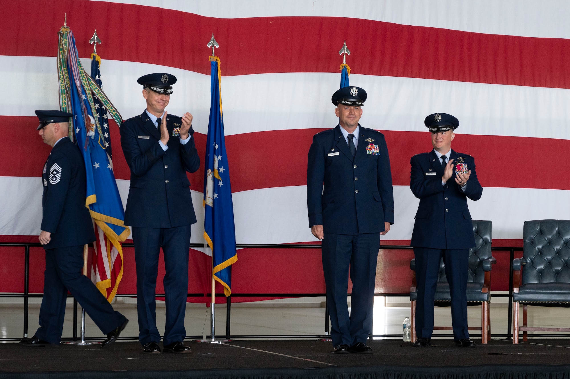U.S. Air Force Col. Kevin Davidson stands at attention after becoming the 47th Flying Training Wing commander at the 47th Flying Training Wing change of command ceremony at Laughlin Air Force Base, Texas, July 22, 2022. As commander, Davidson will oversee nearly 2,800 military and civilian personnel engaged in executing more than 61,000 aircraft sorties yearly in support of Laughlin's Specialized Undergraduate Pilot Training mission. (U.S. Air Force photo by Airman 1st Class Kailee Reynolds)