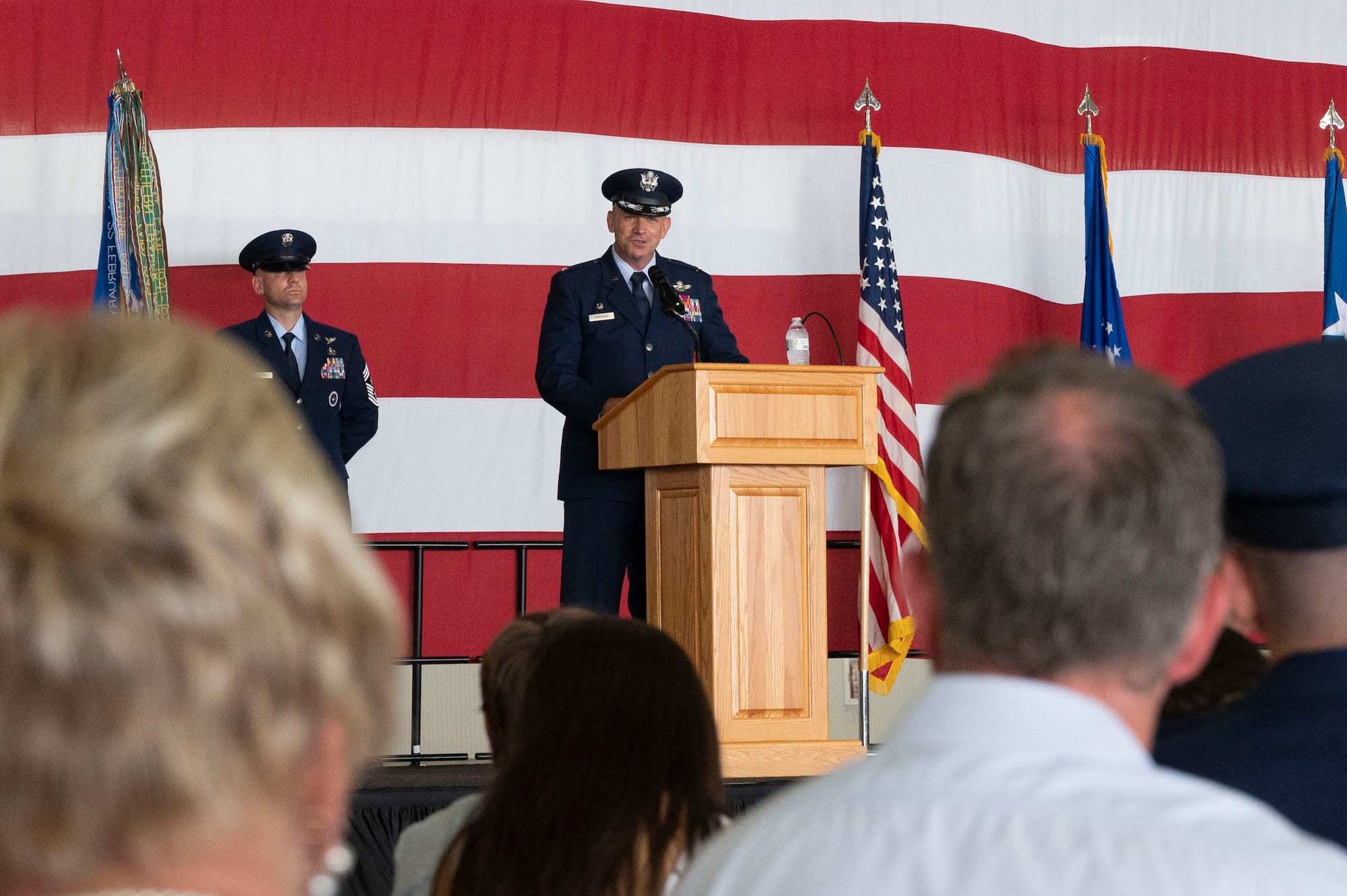 U.S. Air Force Col. Kevin Davidson, 47th Flying Training Wing commander, gives a speech during the 47th Flying Training Wing change of command ceremony at Laughlin Air Force Base, Texas, July 22, 2022. As commander, Davidson will oversee nearly 2,800 military and civilian personnel engaged in executing more than 61,000 aircraft sorties yearly in support of Laughlin's Specialized Undergraduate Pilot Training mission. (U.S. Air Force photo by Airman 1st Class Kailee Reynolds)