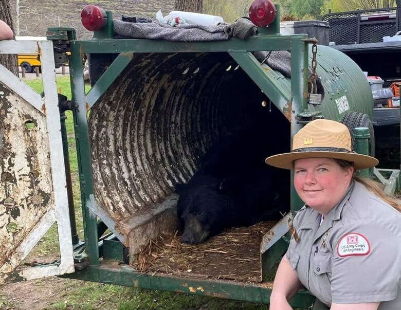 Karen Osler, park ranger, with a bear