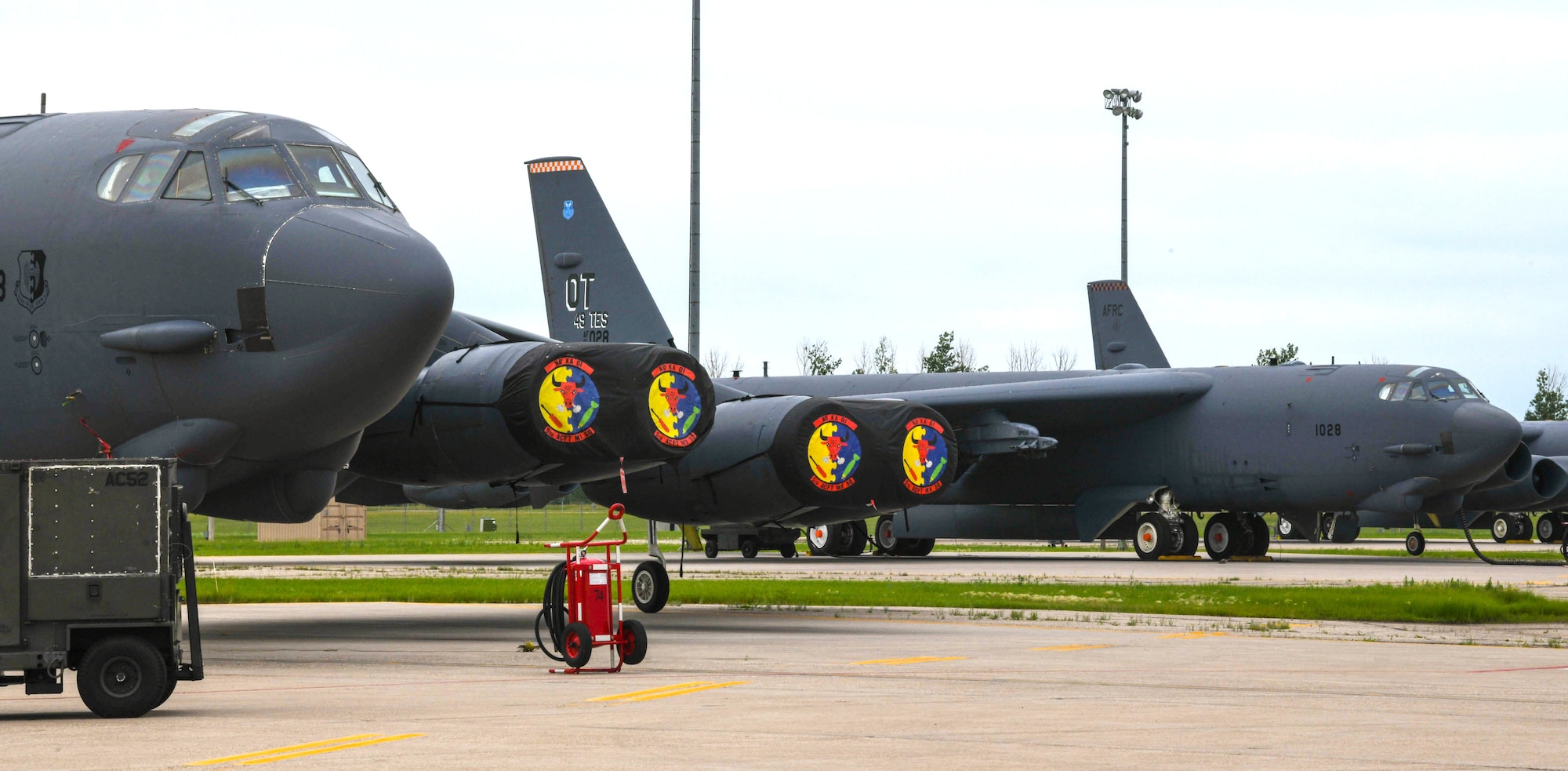A B-52H Stratofortress assigned to the 69th Bomb Squadron is pictured alongside another B-52 assigned to the 49th Test and Evaluation Squadron on July 7, 2022. Both bombers participated in the B-52 Minot Roadshow event where the 49th TES, 340th Weapons Squadron, 69th BS, and 23rd BS executed combined sorties allowing for close collaboration and validation of Tactics, Techniques, and Procedures previously developed by the TES and WPS through integrated flight test. (U.S. Air Force photo by Airman 1st Class Alexander Nottingham)