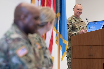 Soldier gives speech from podium.