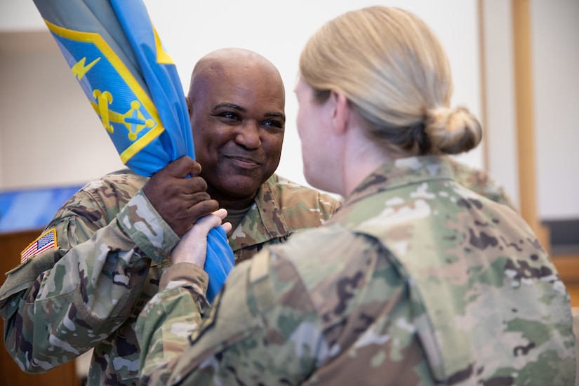 Solder receives unit flag from outgoing commander.