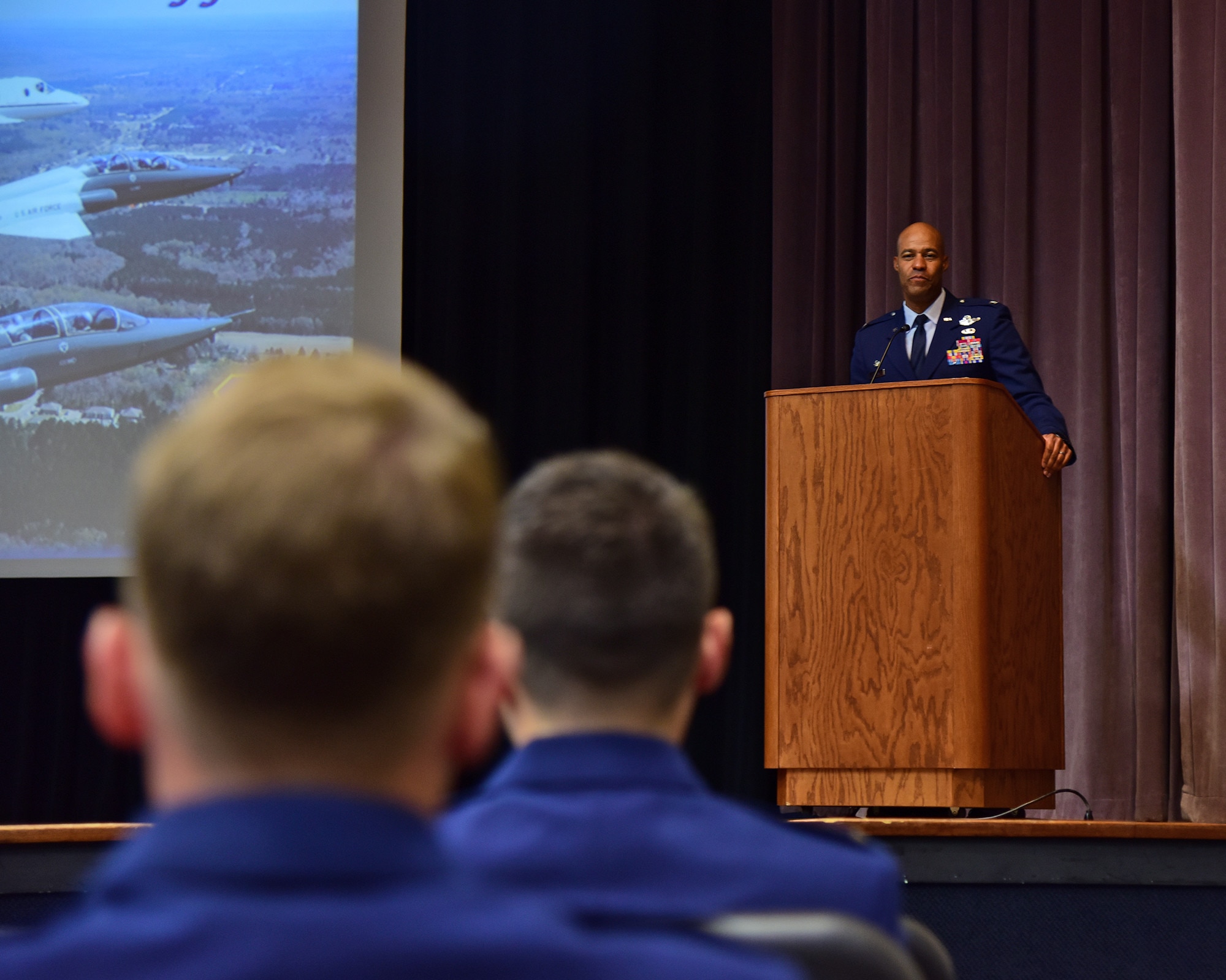 Col. Terence Taylor, 27th Special Operations Wing Commander, congratulates the new pilots of UPT 2.5 on July 22, 2022 at Columbus Air Force Base Miss. Taylor shared his experiences from pilot training with the young pilots.