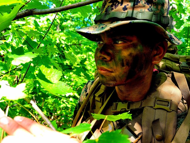 Hospital Corpsman 3rd Class Brian Gutierrez, 2nd Battalion, 24th Marines, conducts a contact patrol with other Corpsmen and Marines on July 22, 2022, during training on North Post at Fort McCoy, Wis. The 2/24 is an infantry battalion based out of Chicago consisting of approximately 1,000 Marines and Sailors. The battalion falls under the 23rd Marine Regiment and the 4th Marine Division. The 2/24 is holding annual training at Fort McCoy.