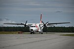 An HC-144 Ocean Sentry taxiis down the tarmac at Coast Guard Air Station Cape Cod post tropical storm Henri on Monday, August 23, 2021. Tropical Storm Henri made landfall in the Northeast bringing heavy rainfall, storm surges, and heavy winds across the coast. (U.S. Coast Guard Photo by Petty Officer Third Class Ryan L. Noel)