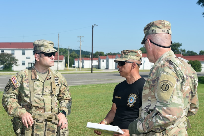 Brig. Gen. Richard Corner, left, Commanding General and Command Sgt. Major Steven Slee, right, 85th U.S. Army Reserve Support Command, receive a brief during Warrior Exercise 78 at Fort McCoy, Wisconsin, July 21, 2022.