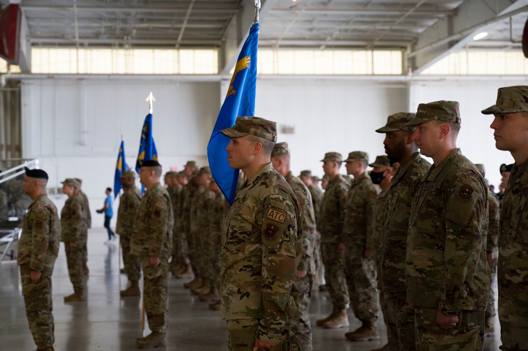 Members of each group within the 47th Flying Training Wing stand in formation during the 47th Flying Training Wing change of command ceremony at Laughlin Air Force Base, Texas, July 22, 2022. This formation gives the first and final salute to the incoming and outgoing 47th Flying Training Wing commander during the ceremony. (U.S. Air Force photo by Airman 1st Class Kailee Reynolds)