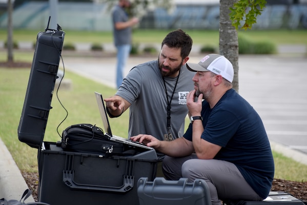 HNC’s Brian Roden (L) and Josh Mason monitor a flight over the UAH campus.