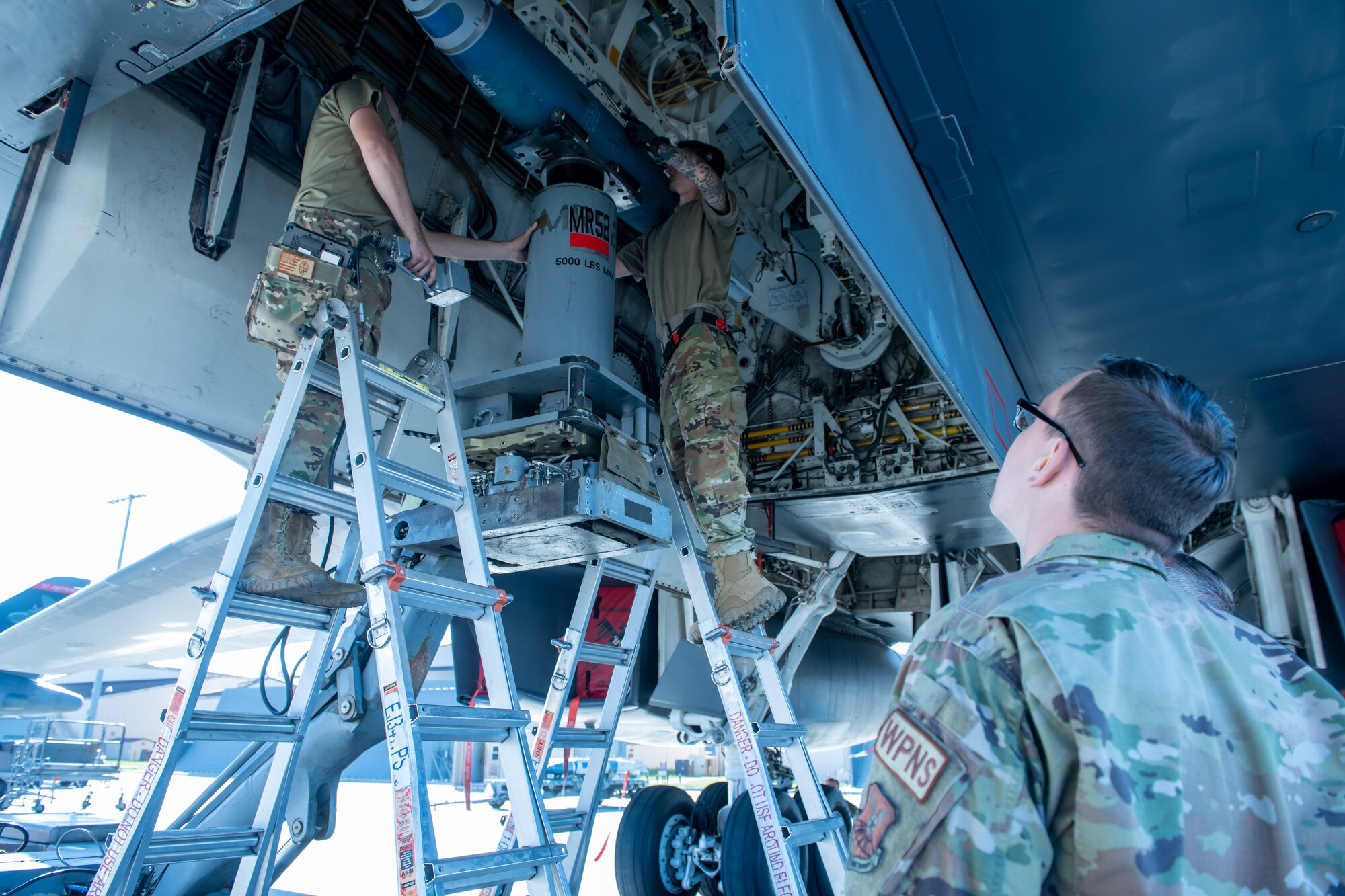 U.S. Air Force Airmen from the 28th Aircraft Maintenance Squadron compete in a weapons loading competition at Ellsworth Air Force Base, S.D., July 22, 2022.