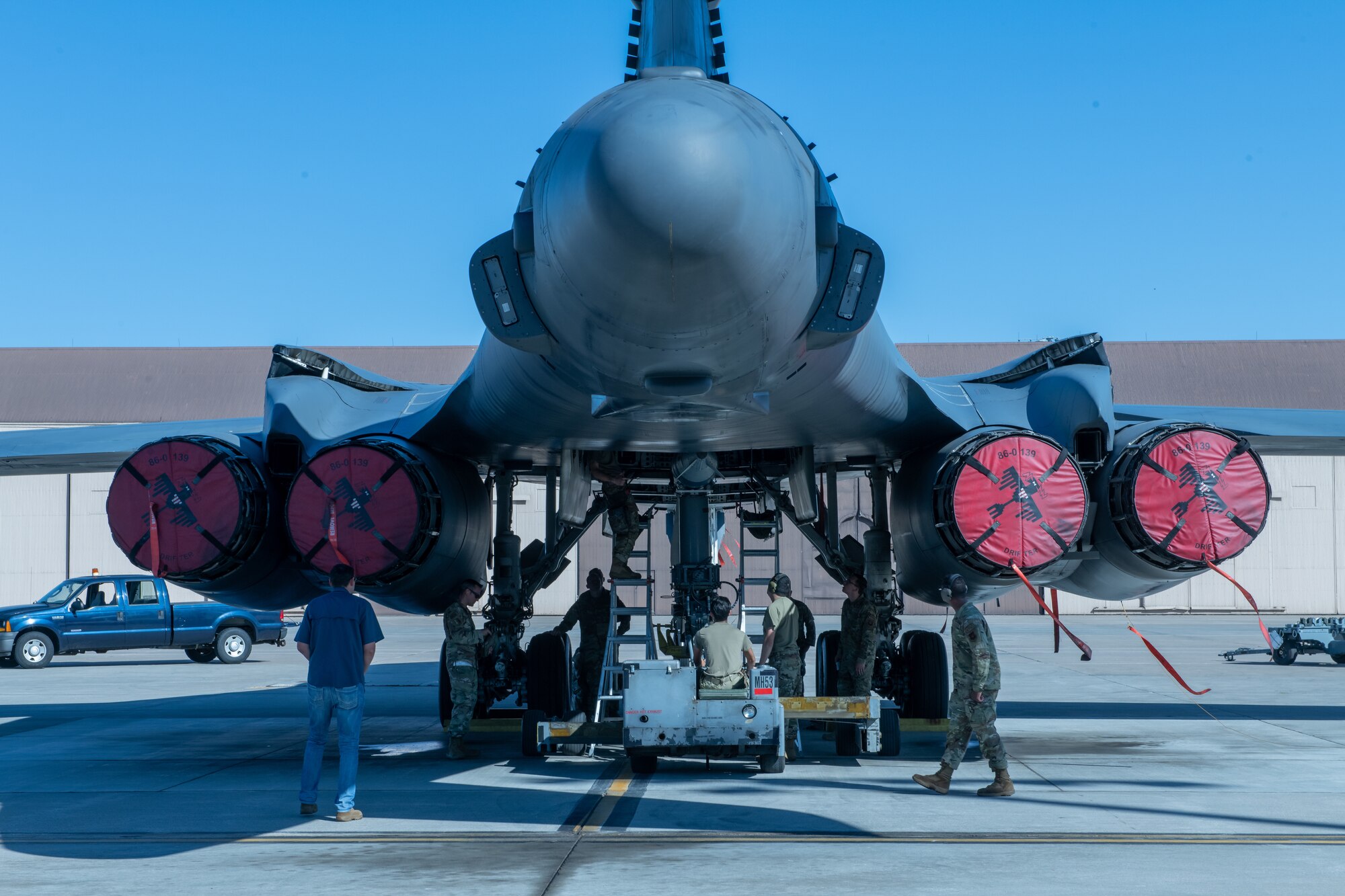 U.S. Air Force Airmen from the 28th Aircraft Maintenance Squadron load the final munitions of a weapons loading competition into a B-1B Lancer at Ellsworth Air Force Base, S.D., July 22, 2022.