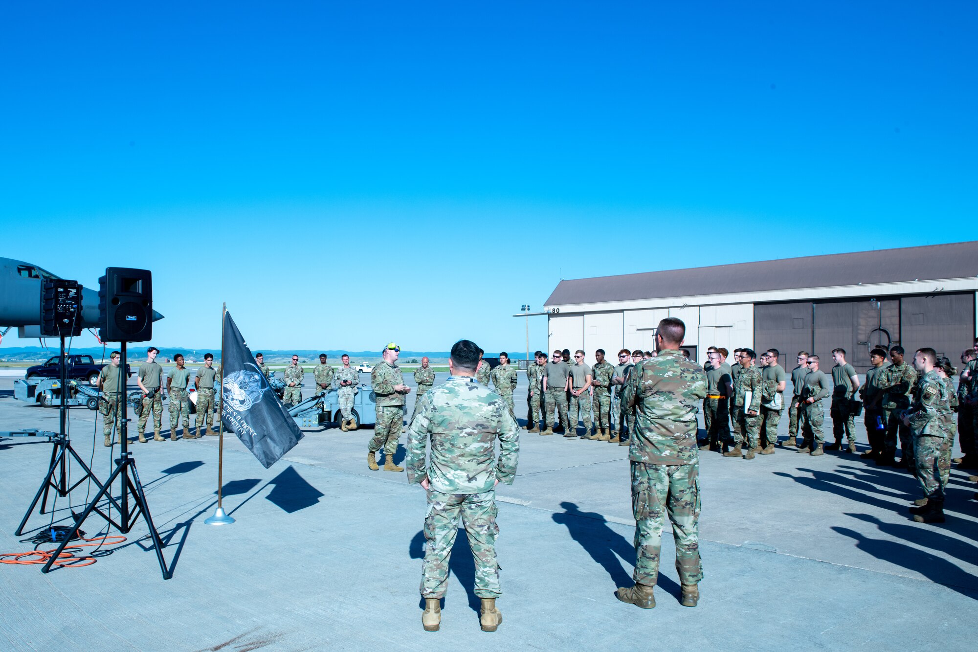 U.S. Air Force Airmen from the 28th Aircraft Maintenance Squadron are briefed before an inter-squadron weapons loading competition at Ellsworth Air Force Base, S.D., July 22, 2022.