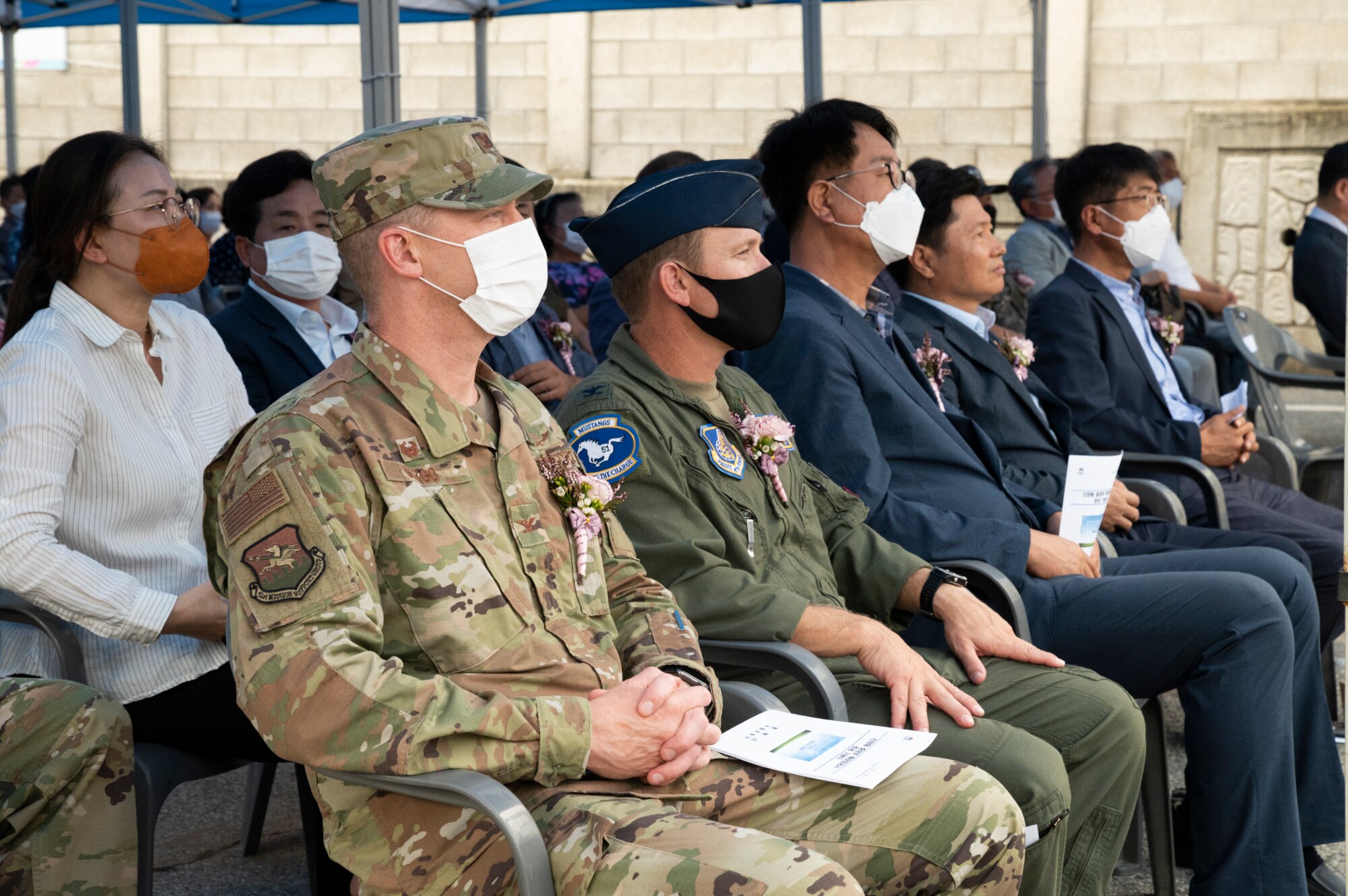 Col. Paul Davidson, 51st Fighter Wing Vice commander, and Col. Kyle Grygo, 51st Mission Support Group commander, attend the ribbon cutting ceremony celebrating the newly constructed roundabout outside of Osan Air Base, Republic of Korea, July 25, 2022.