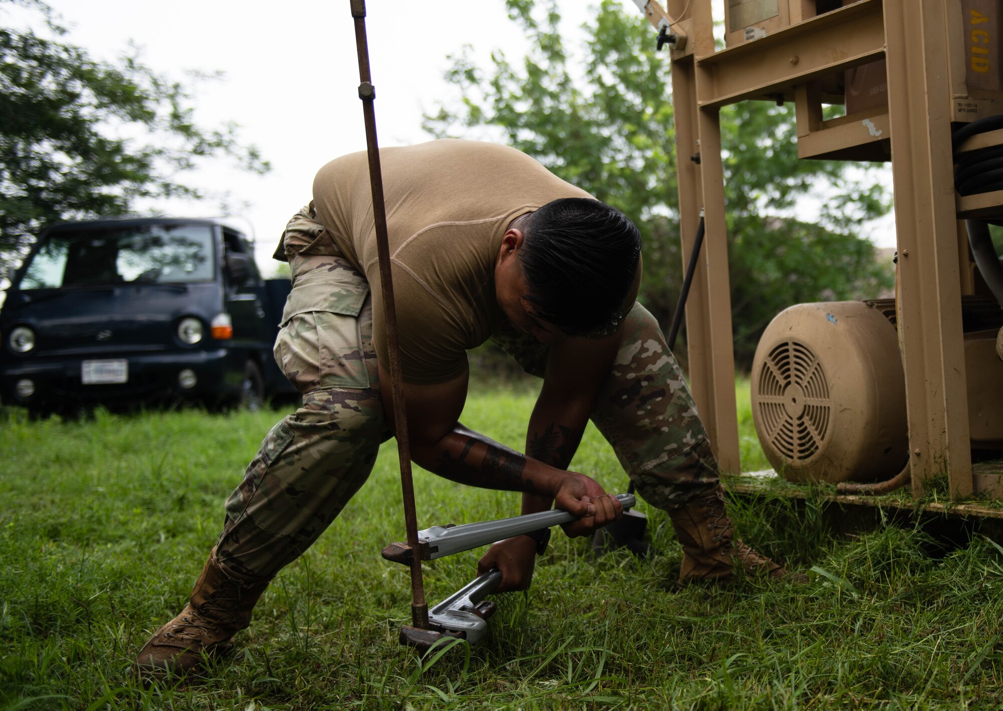 An Airman used a wrench to tighten a rod bar stud.