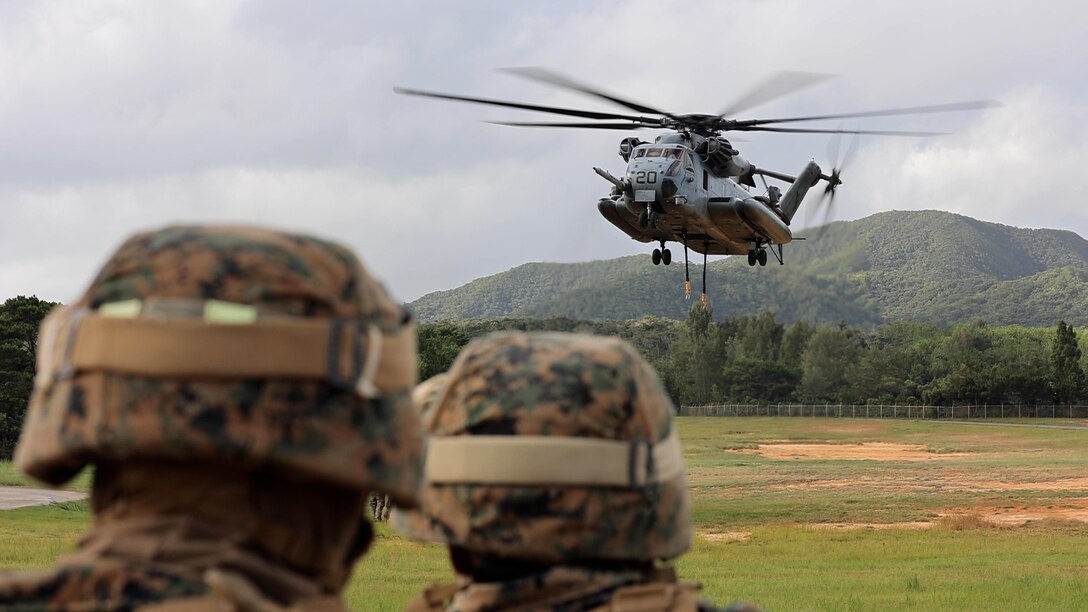 U.S. Marines with 3d Battalion, 12th Marines conduct an airlift of a Joint Light Tactical Vehicle at a helicopter external lift drill on Camp Hansen, Okinawa, Japan, July 19, 2022. 3/12 regularly conducts airlift training to improve rapid insertion and extraction of equipment, producing lethal, ready, and adaptable forces capable of operations across a wide range of missions. (U.S. Marine Corps photo by Cpl. Alyssa Chuluda)